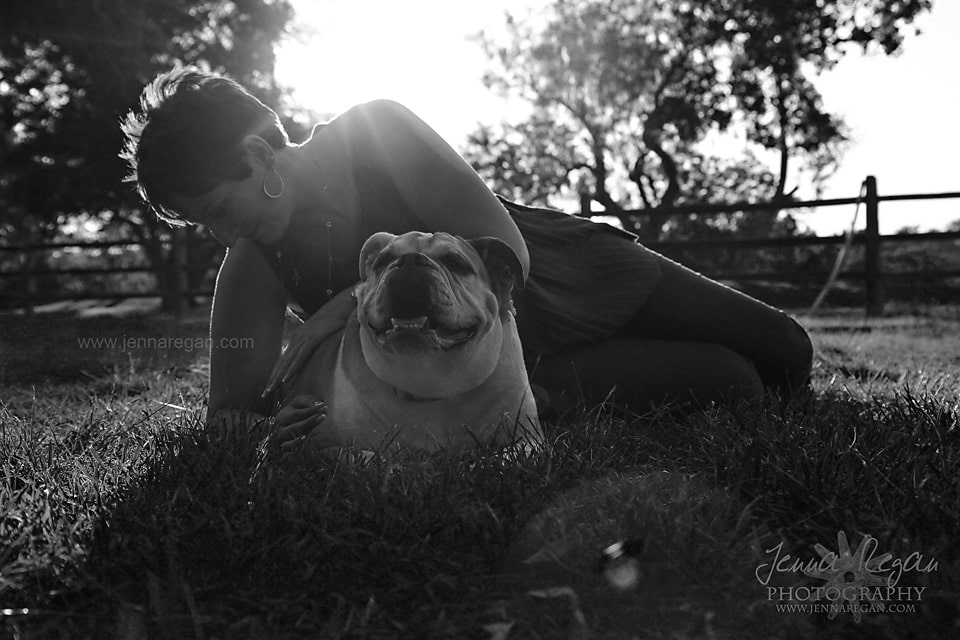 black and white photo of woman with bulldog at sunset fort worth texas