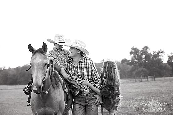 black and white family photo with horse