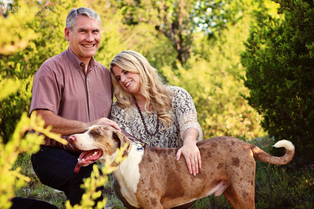 couple poses with their beloved dog during outdoor photo shoot in fairview texas