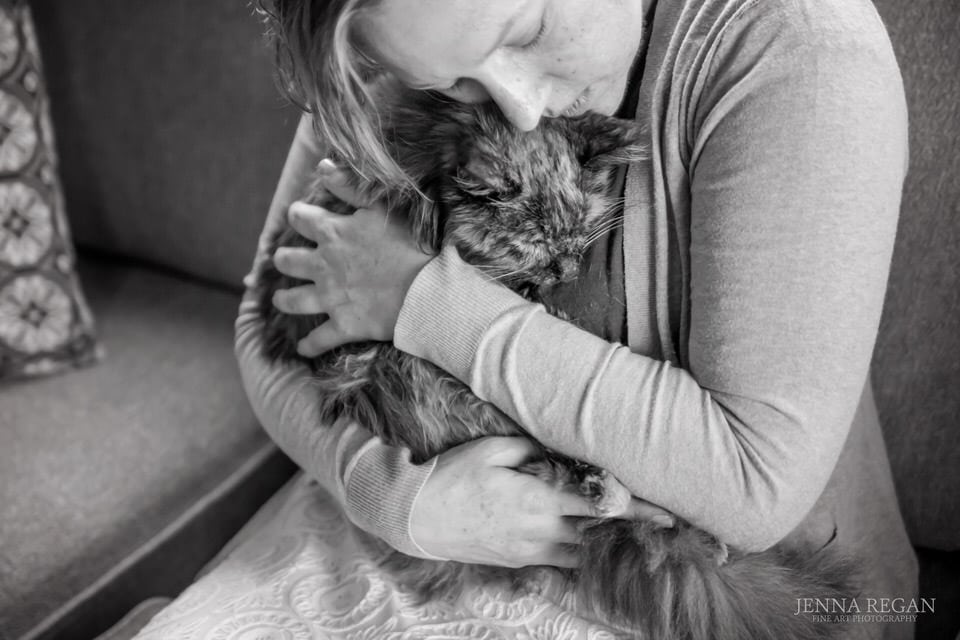 fine art photograph of cat and owner in black and white